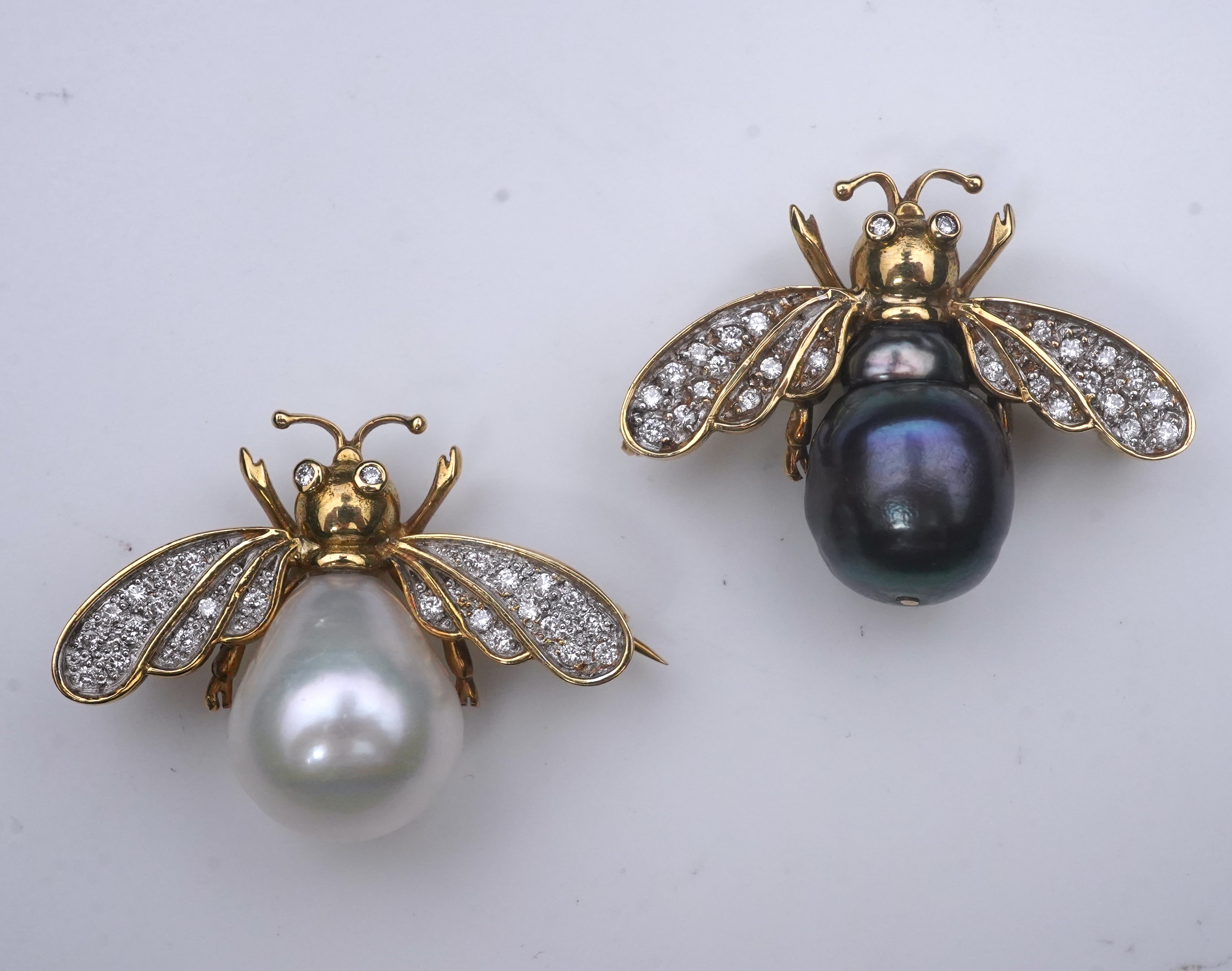 Deakin & Francis, a pair of 18ct gold, cultured pearl and diamond brooches